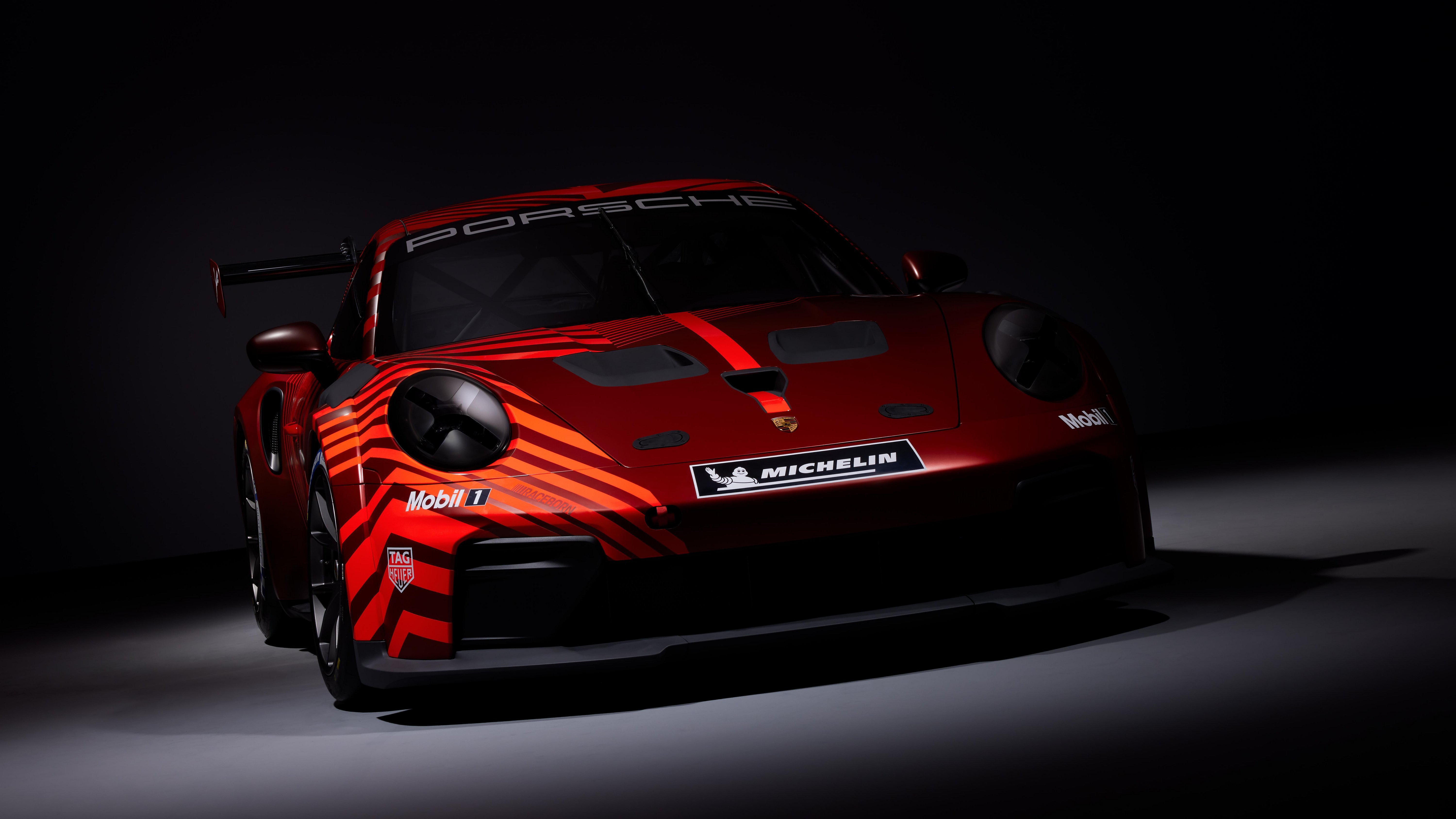 Porsche 911 GT3, factory reveal camouflage livery, front three-quarter