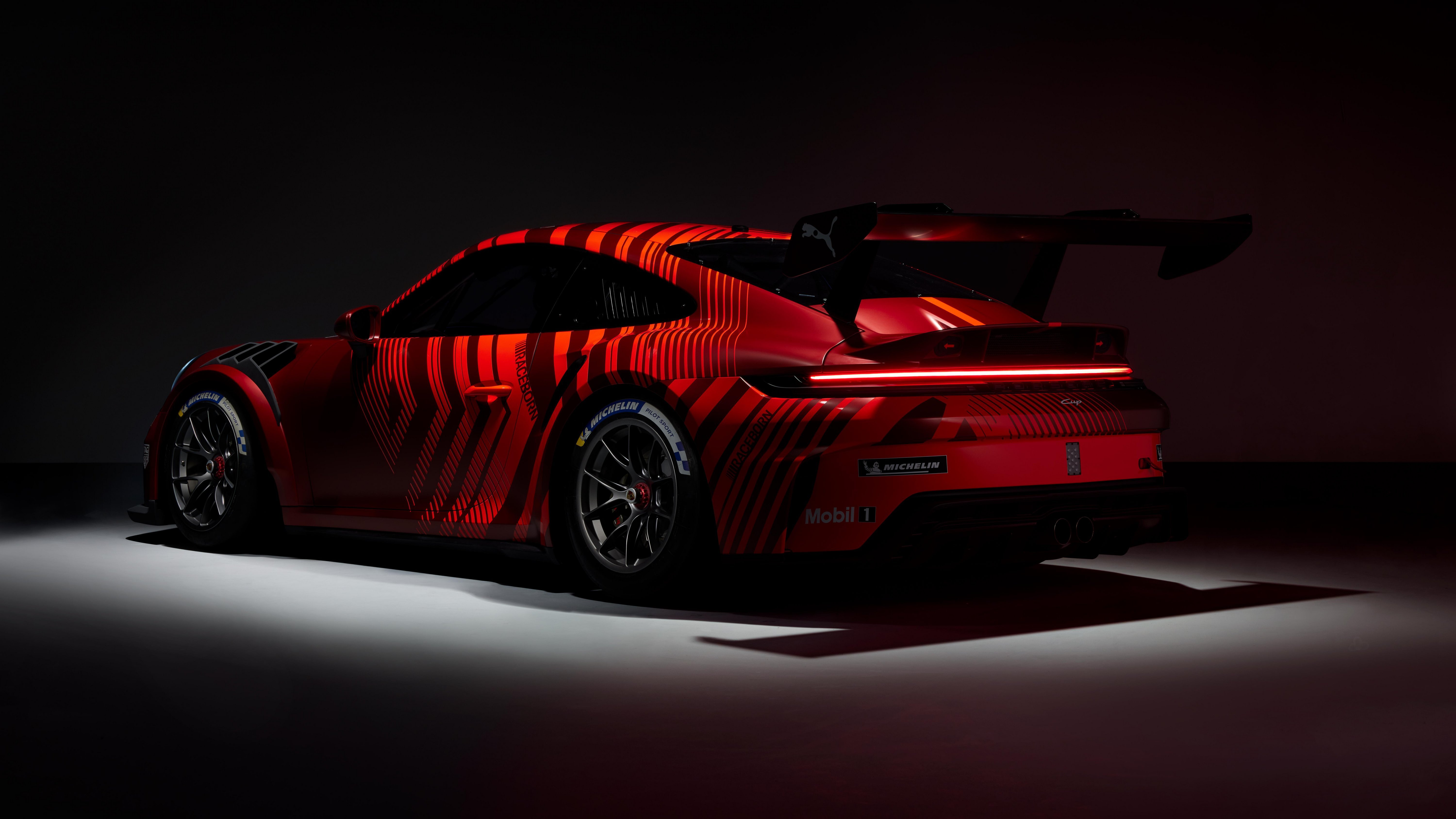 Porsche 911 GT3, factory reveal camouflage livery, rear three-quarter