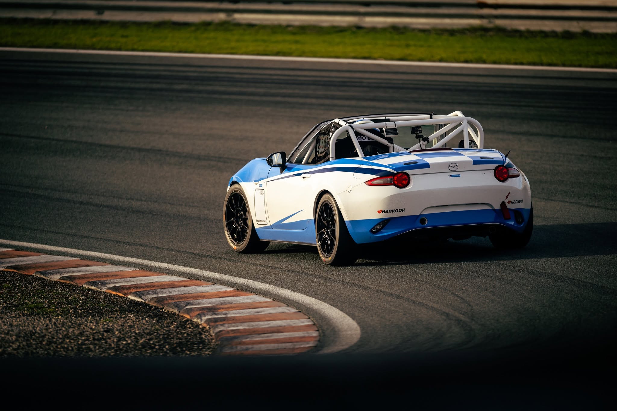NiceRacing Mazda MX-5 Cup car on track, rear three-quarter