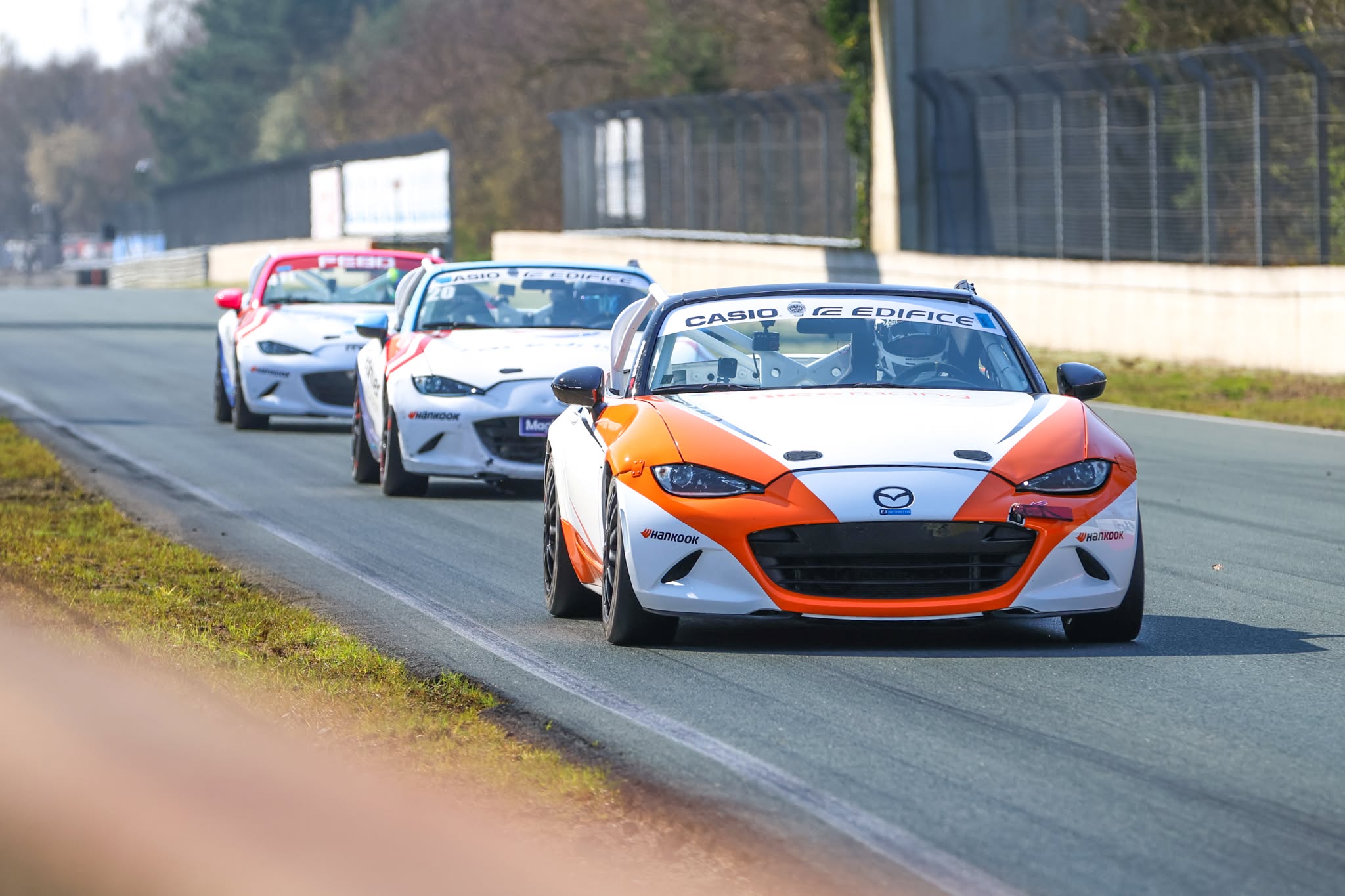 NiceRacing Mazda MX-5 Cup car leading a group of MX-5s on track